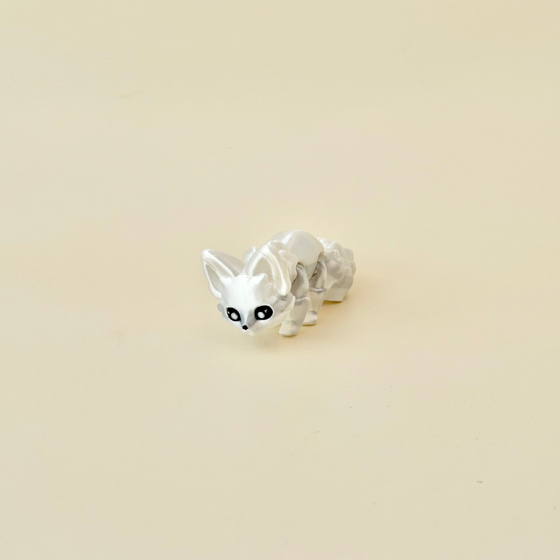 3D printed fox fidget in glossy white; lightweight, portable and satisfying to manipulate.
