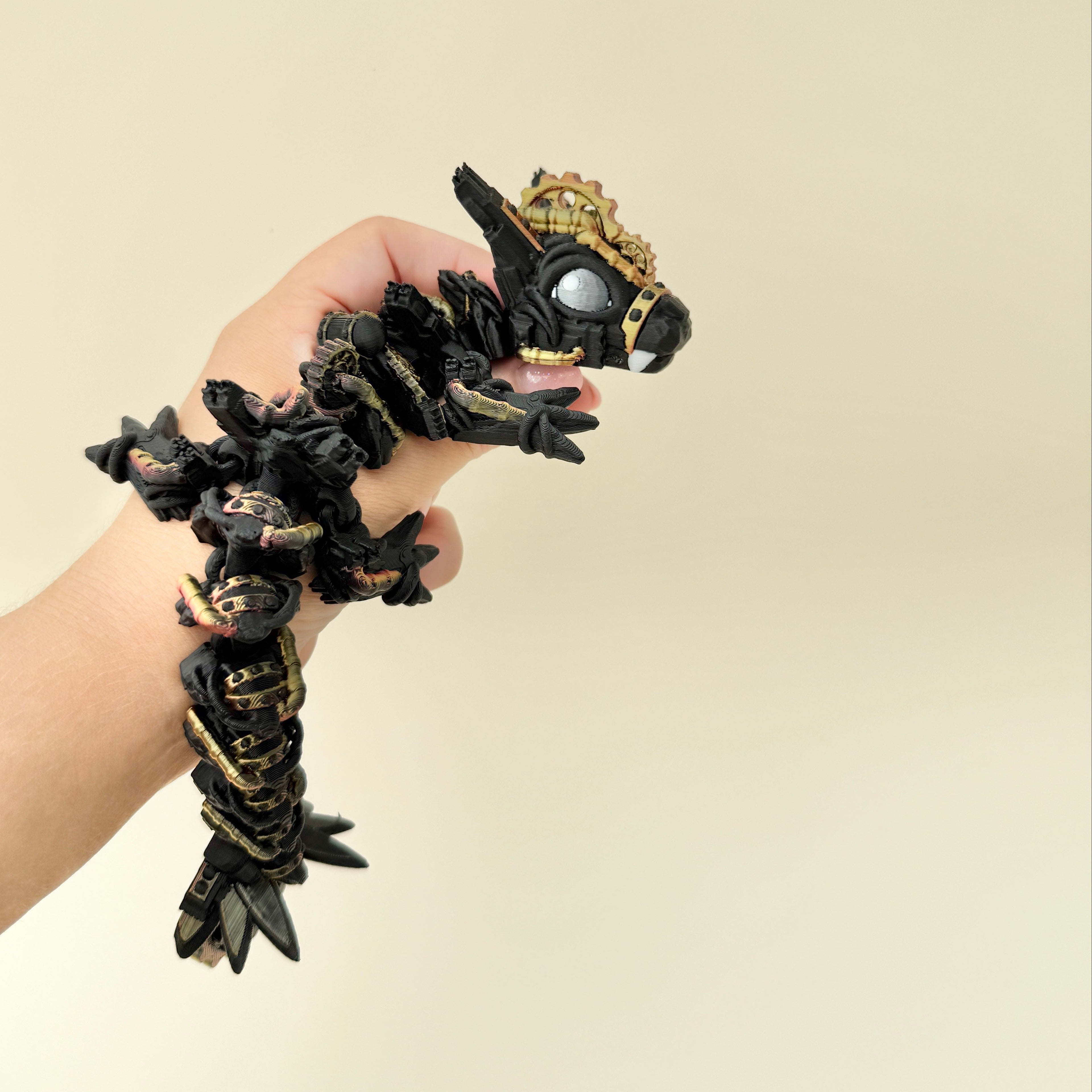 Steampunk dragon toy with movable joints and raised textures, ideal for sensory engagement and display