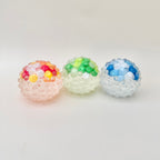 Squishy fidget with visual sensory elements for calming stimulation, stress relief and satisfying squeeze moments.
