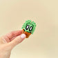 Miniature plant figure with ivy leaves and a cute expression, designed for sensory and visual play.