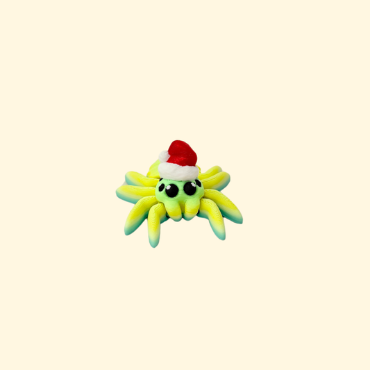 Mini articulated spider fidget in blue-green-yellow with a Santa hat.
