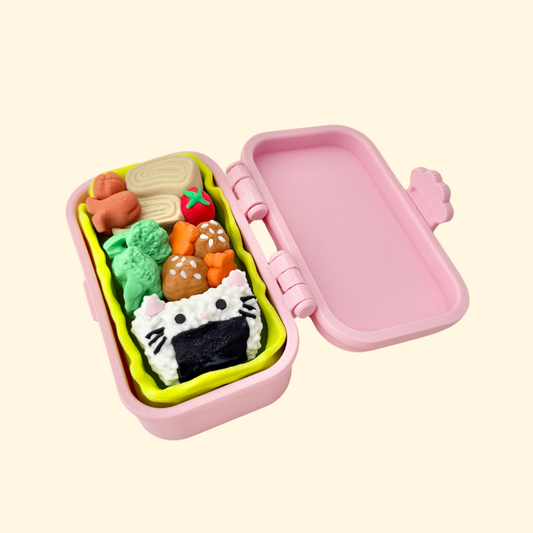 Kawaii bento clicker with three food buttons in a pastel box; choose Pink, Blue or Lilac.
