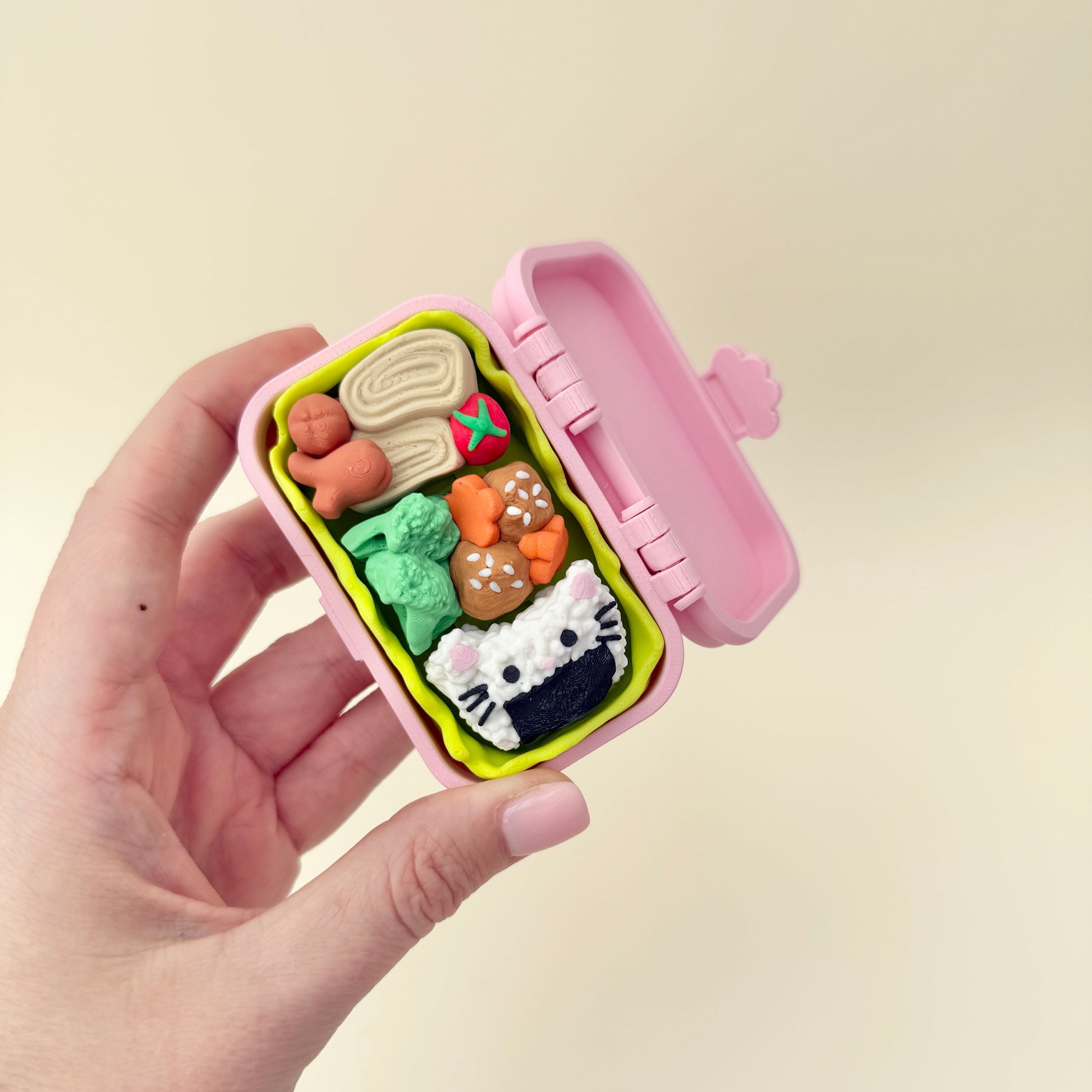 Cute pastel lunchbox clicker with textured food details; study and desk friendly.
