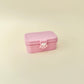 Bento clicker in a paw-clasp box with three pressable buttons; portable and giftable.
