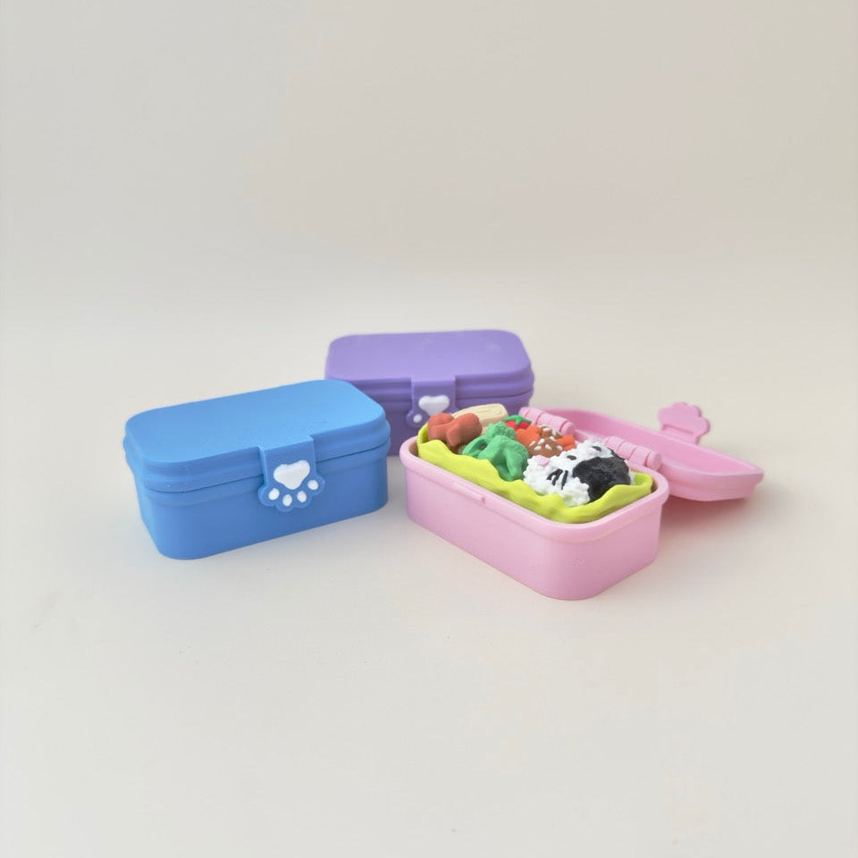 Bento-style desk fidget with three tactile buttons for rhythmic clicks; compact 8 cm.
