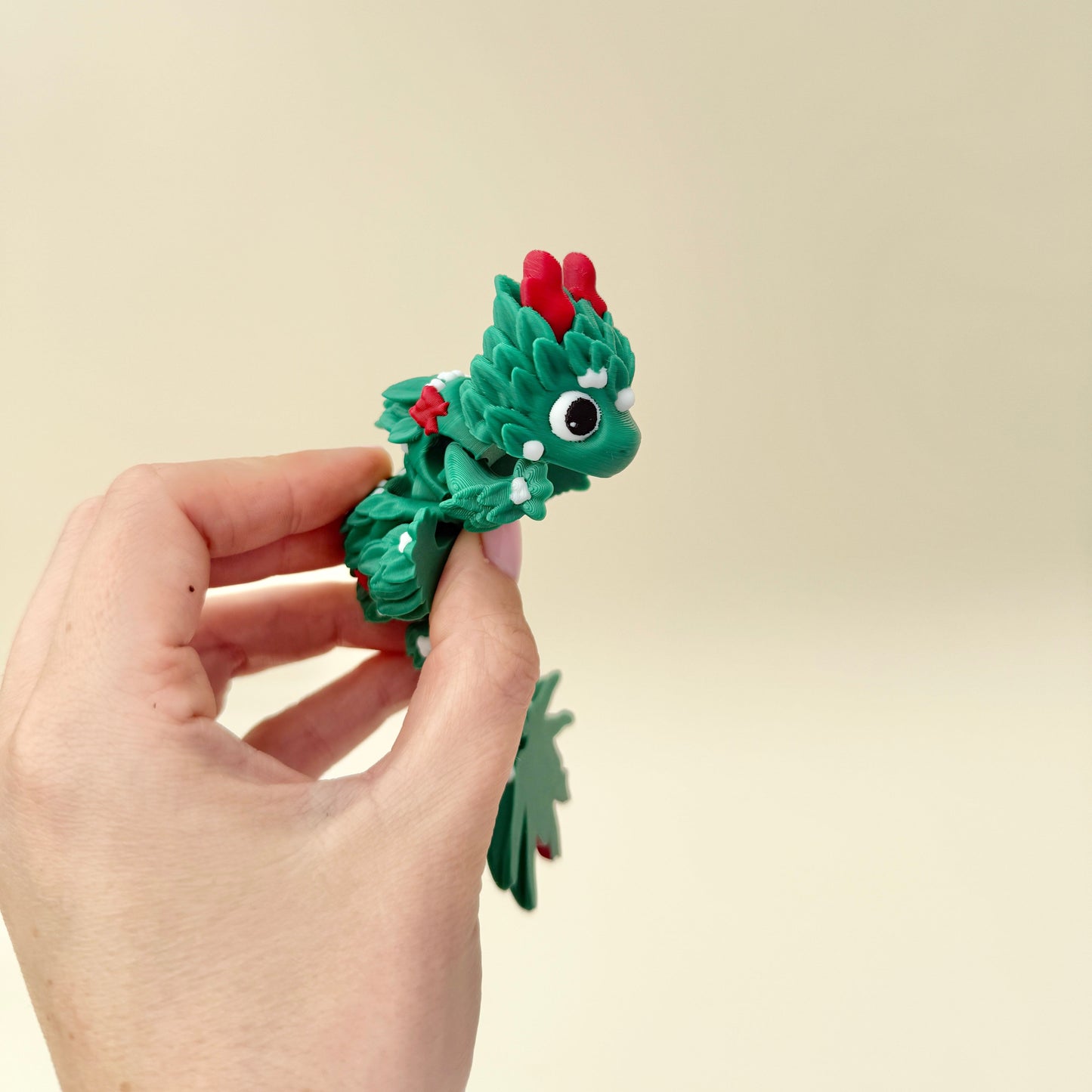 Holiday dragon fidget ideal for stockings, Secret Santa, or display.