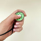 Palm-size fruit clicker providing light pain-stim and trace-stim feedback.
