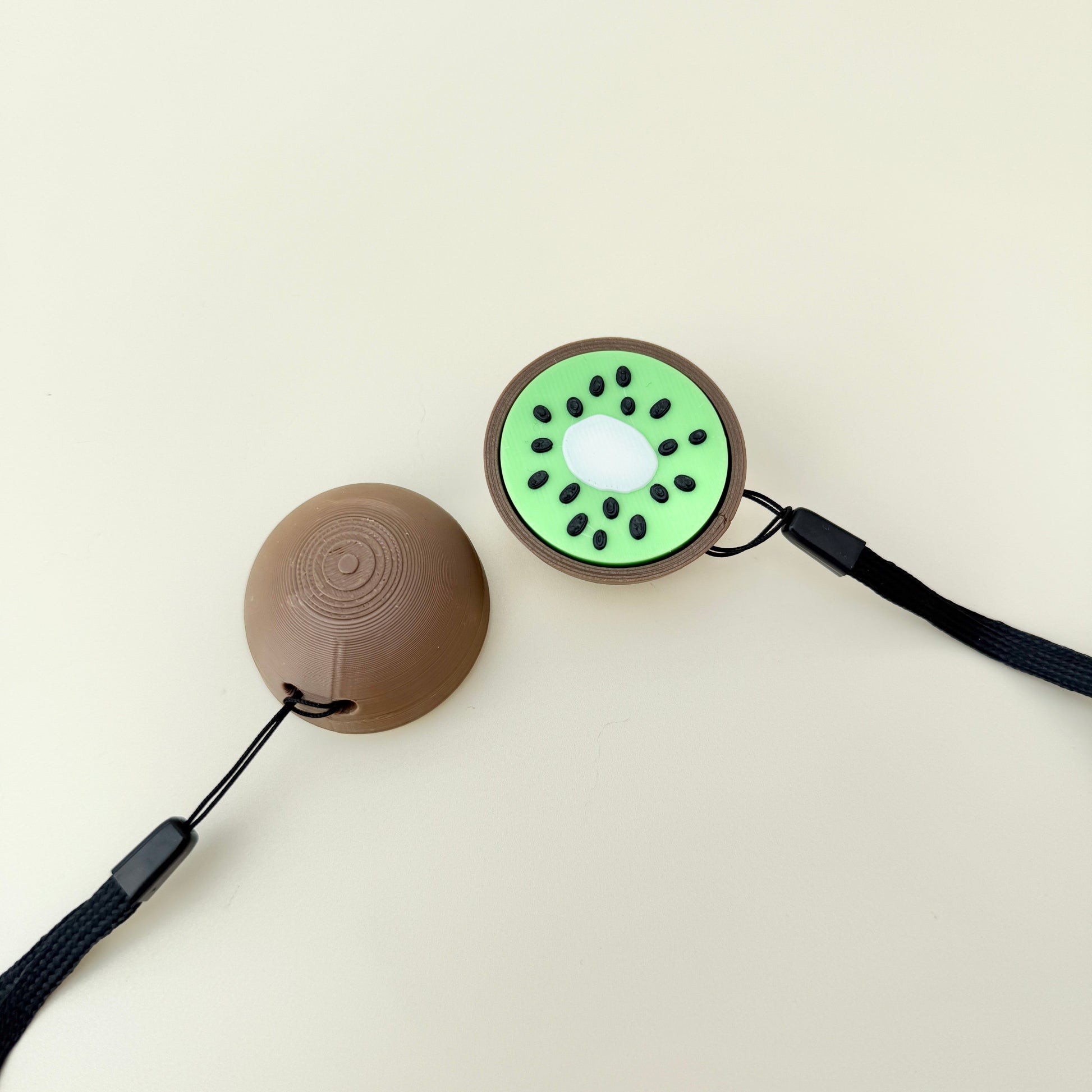 Compact kiwi fidget with raised seeds and satisfying click for focus and relief.
