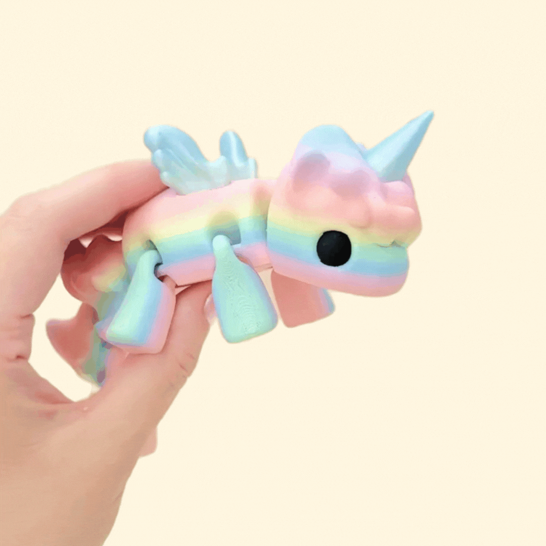 Large Unicorn fidget toy with a rainbow body and iridescent wings and horn, fully articulated for sensory play.