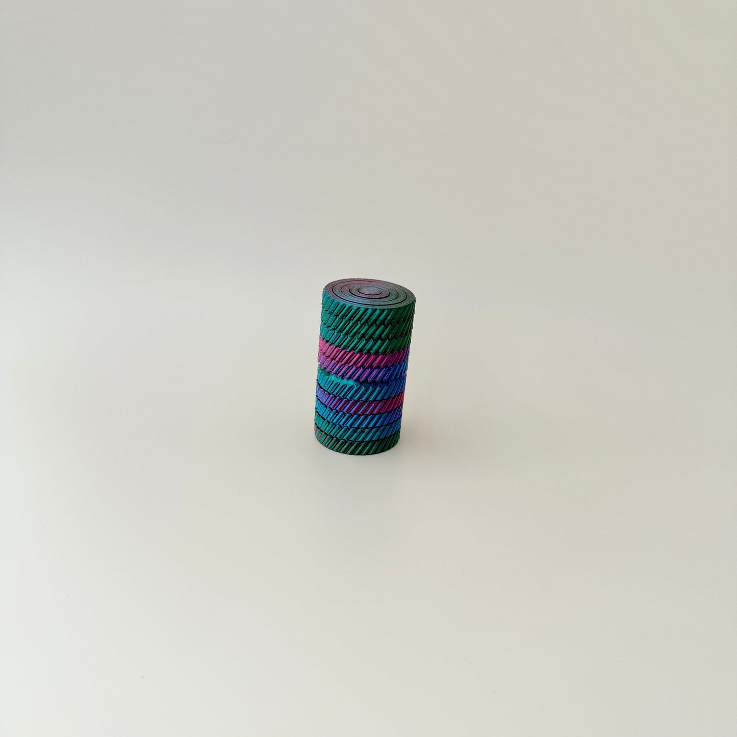A big fidget toy with vibrant colours and multiple layers that move independently.