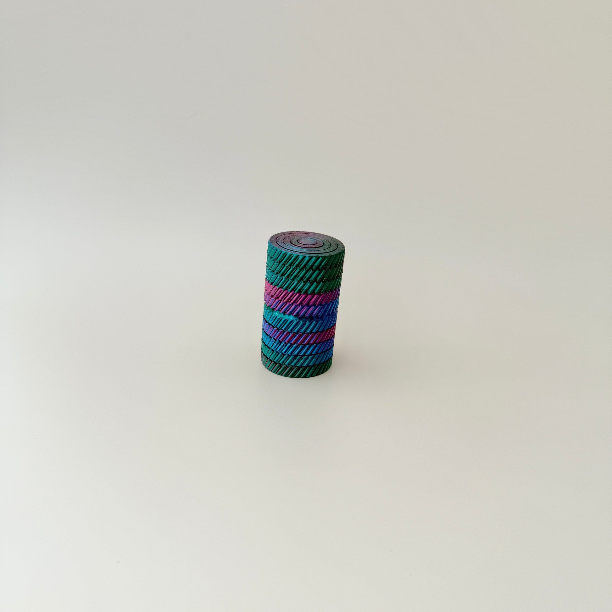A big fidget toy with vibrant colours and multiple layers that move independently.