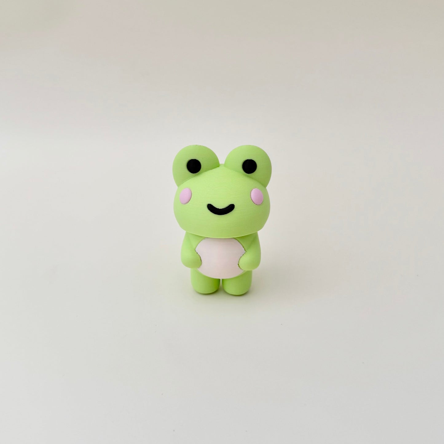An oversized frog clicker offering satisfying presses and calming repetitive movement
