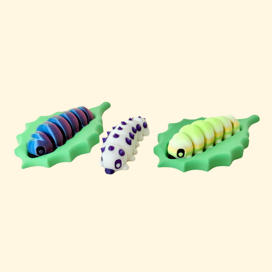 Articulated caterpillar fidget with leaf base for sensory play.
