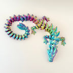 Stunning 64cm Crystalborne Dragon with shifting colours of red, blue, and gold, perfect for sensory play and collecting.