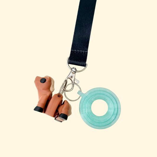 Small articulated horse lanyard add-on with smooth body and textured mane and tail for tactile tracing and calming fidgeting.
