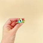 Tactile and portable sea turtle sensory toy with articulated movement and detailed features.