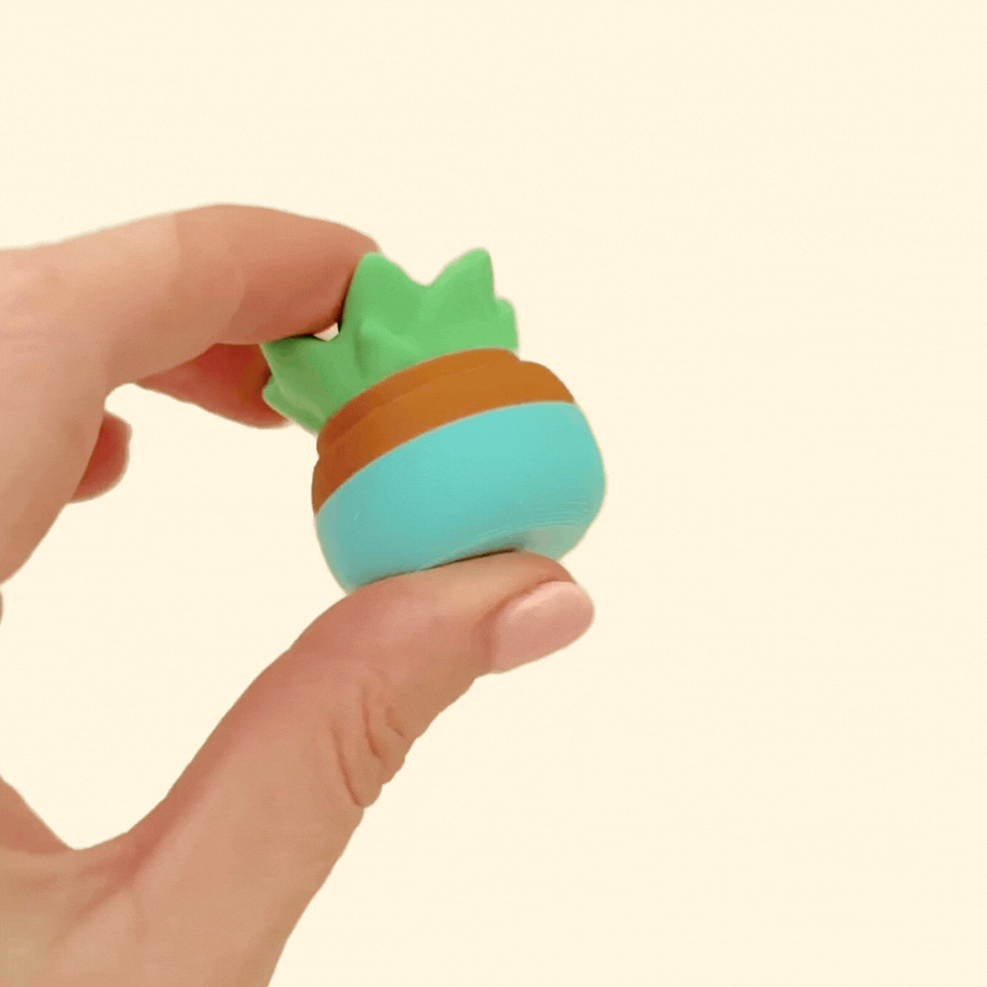 A compact fidget toy designed to look like a potted succulent, perfect for quiet desk fidgeting.