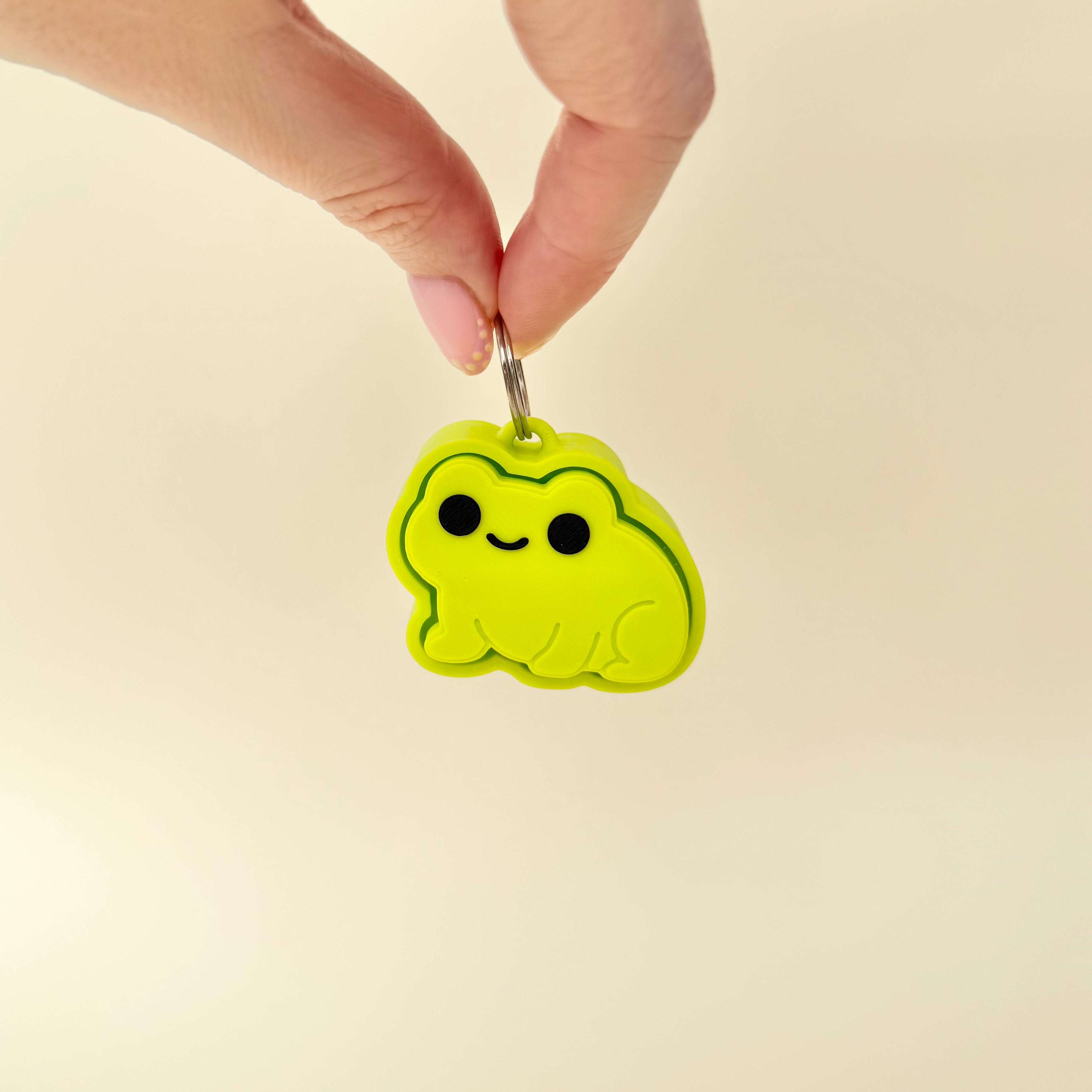 Cute frog clicker keyring fidget for discreet sensory support, travel and busy hands.
