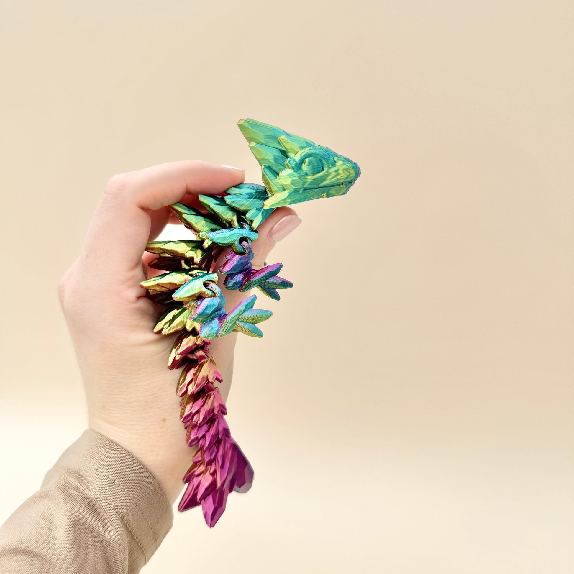 Stunning mini dragon fidget toy, available in two colour-changing variants, perfect for play or display.