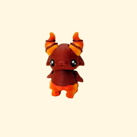Small fantasy fidget toy with a textured surface and bright colouring
