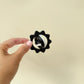 black and white sensory spinner for focus, grounding and discreet fidgeting
