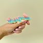 Colourful fidget dragon with unpredictable rainbow colour placement and articulated limbs.