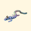 Poseable dragon sensory toy with smooth segments for fidgeting, focus support and stress relief on the go.
