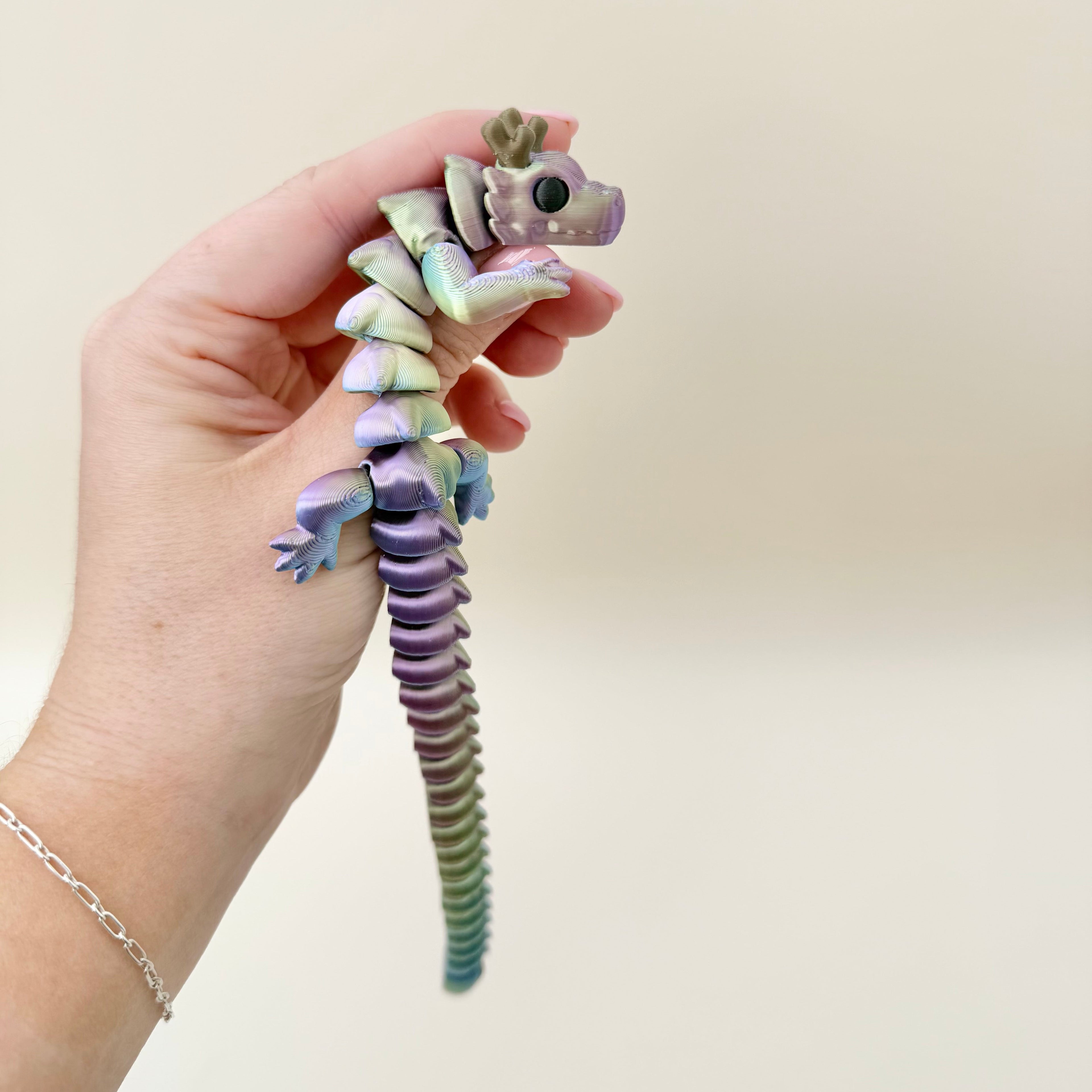 Jointed dragon mini fidget designed for soothing wiggles, tactile stimulation and everyday anxiety relief.