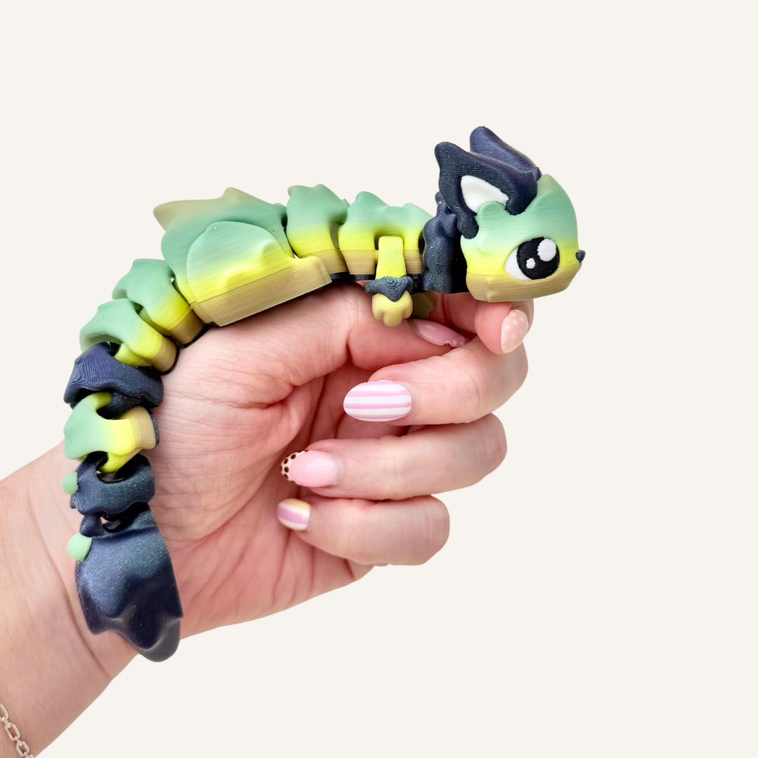 Fantasy-inspired articulated fidget with poseable sections, tracing texture and satisfying hand movement.
