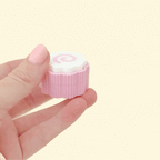 Fidget clicker inspired by narutomaki with a pink and white swirl design.