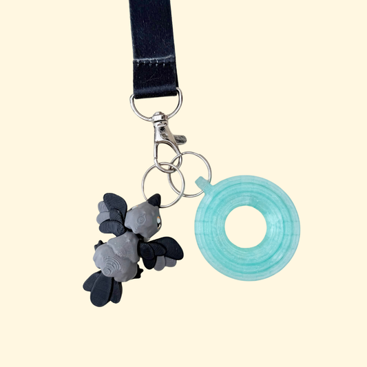 Crow stim keyring add-on made for lanyards, quick access and discreet sensory regulation.
