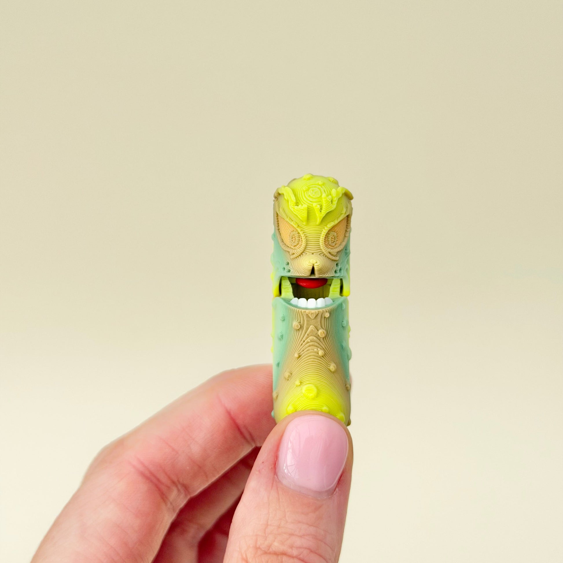 A quirky pickle-shaped sensory toy with gentle articulation for light fidgeting and humour.
