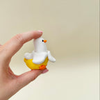 Whimsical banana duck sensory toy with a satisfying mechanical click and smooth handheld design.
