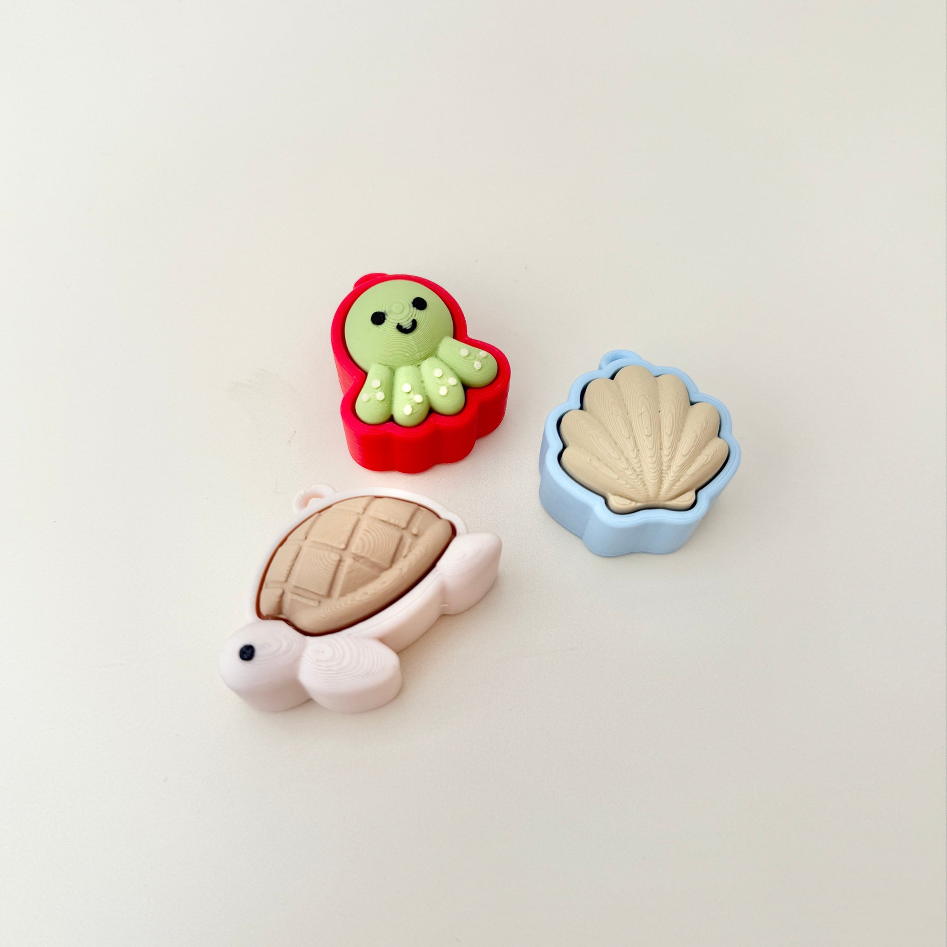 cute sea-themed clicker with raised dots and loop, great for sensory play
