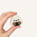 Cute onigiri-inspired clicker fidget with a smooth finish and satisfying press action for stress relief and focus.

