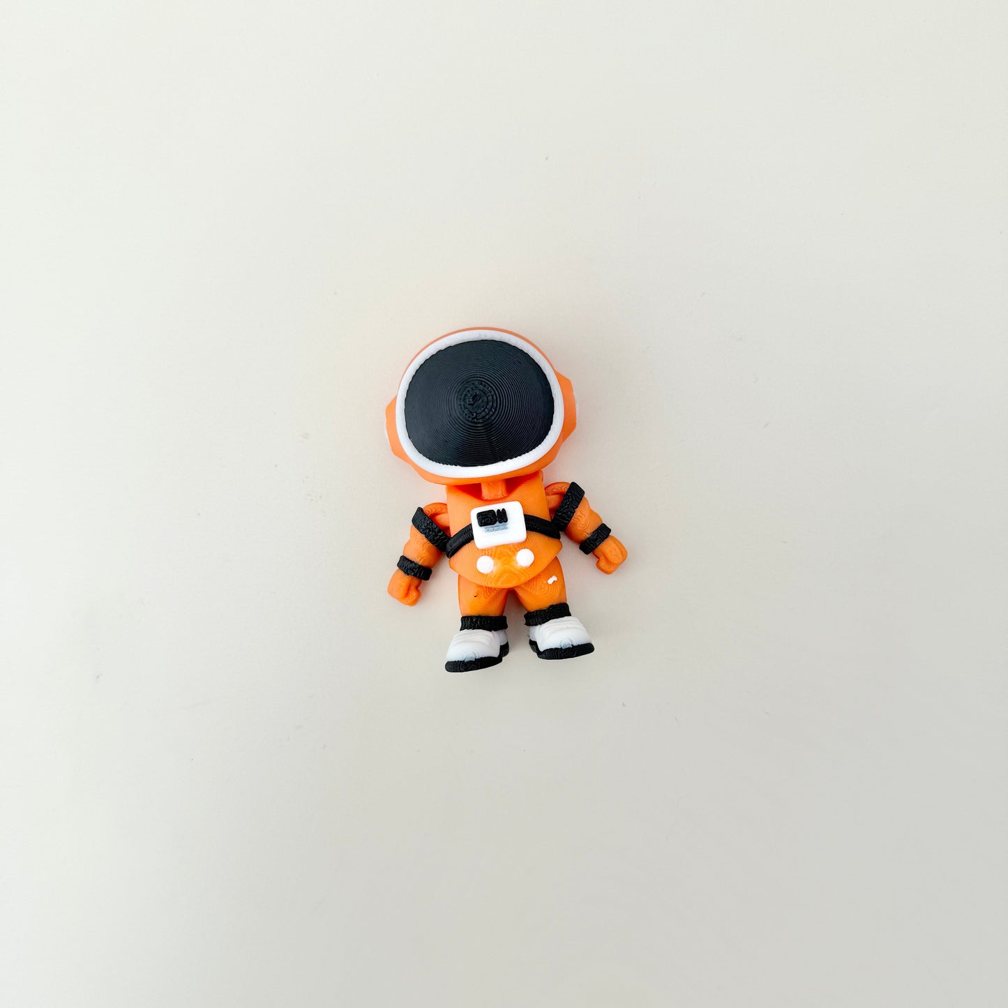 Textured suit and chunky boots provide tactile interest.
