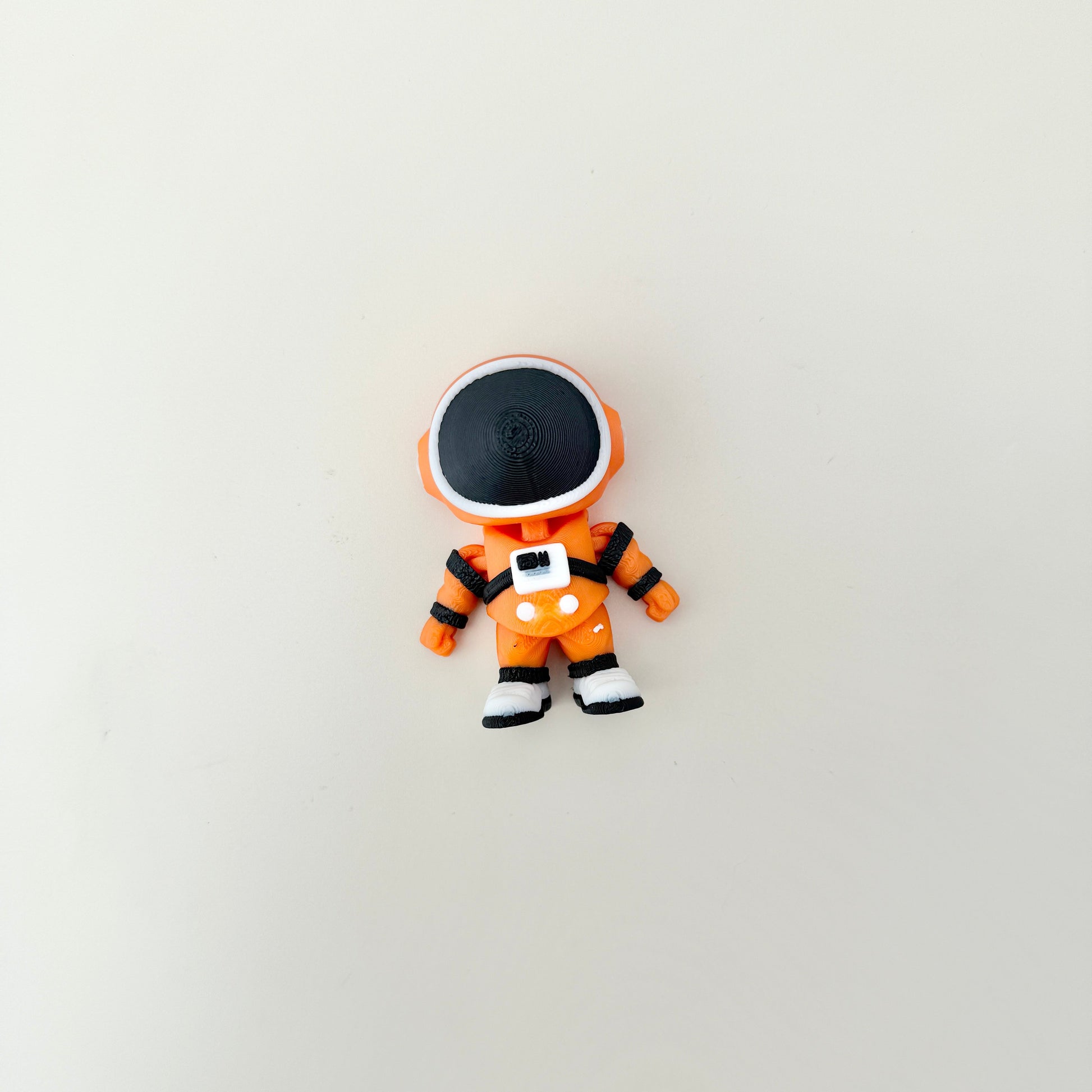 Textured suit and chunky boots provide tactile interest.
