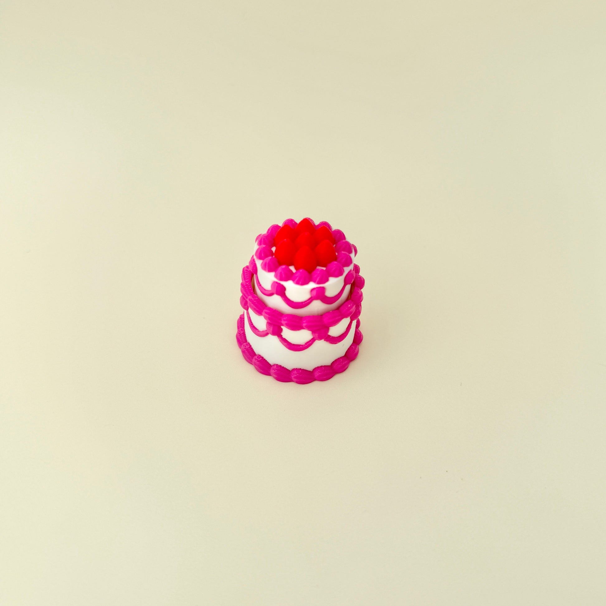 small cake shaped clicker toy for neurodivergent users and collectors
