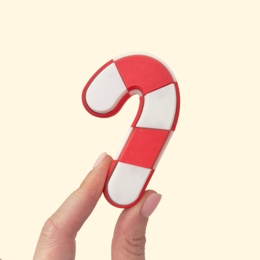 red and white candy cane fidget clicker with five tactile pop tiles
