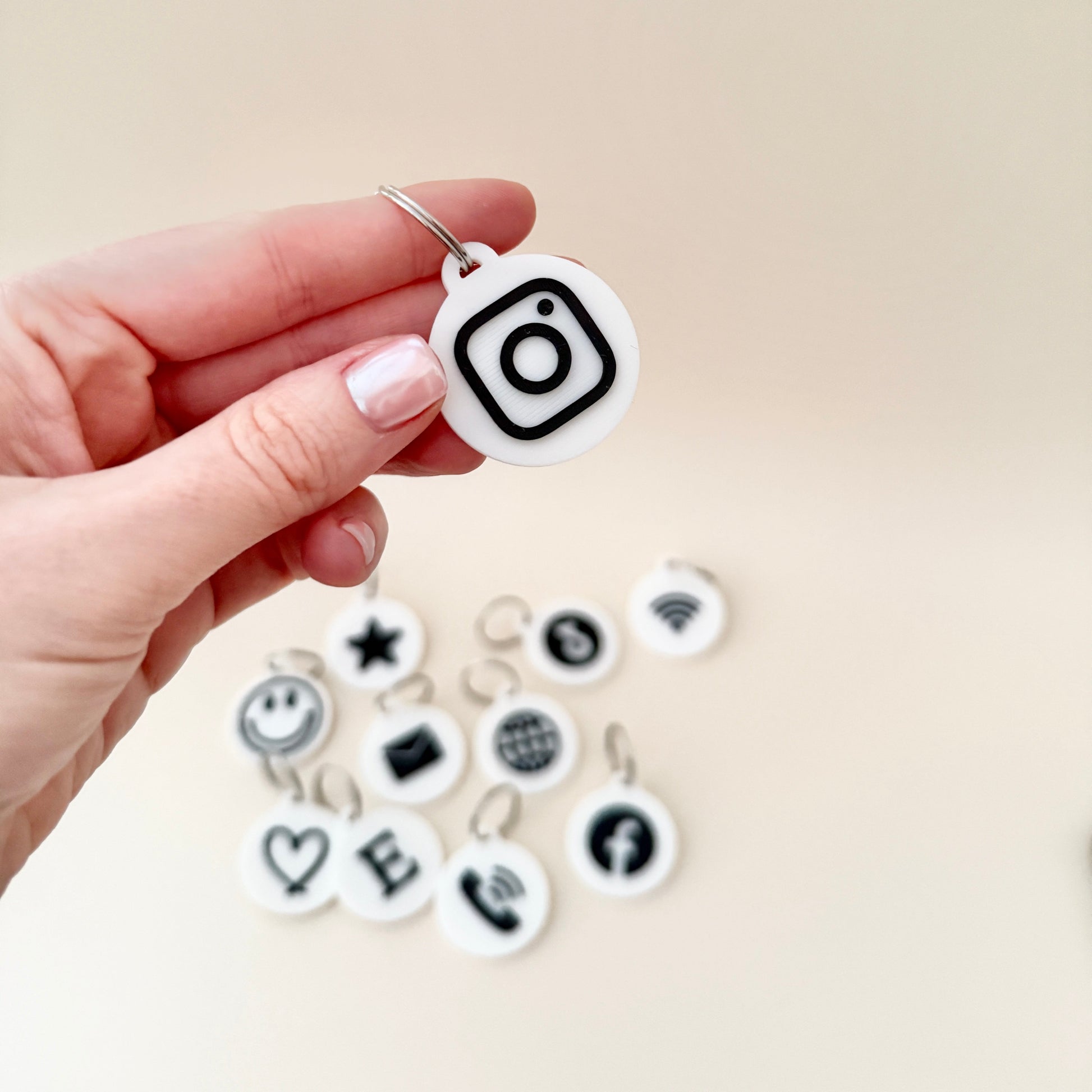 An NFC keyring with a world icon, demonstrating how it can be programmed with personalised information like websites or contact details.