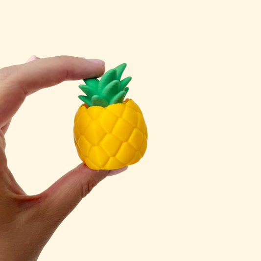 fruit-shaped fidget clicker with textured surface for sensory stimming
