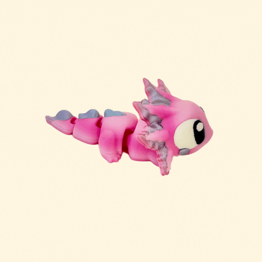 Portable, articulated sensory toy in soft pink and white gradient colours, ideal for all ages.