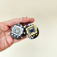 compact halloween fidget toy with press-to-click centre and raised texture
