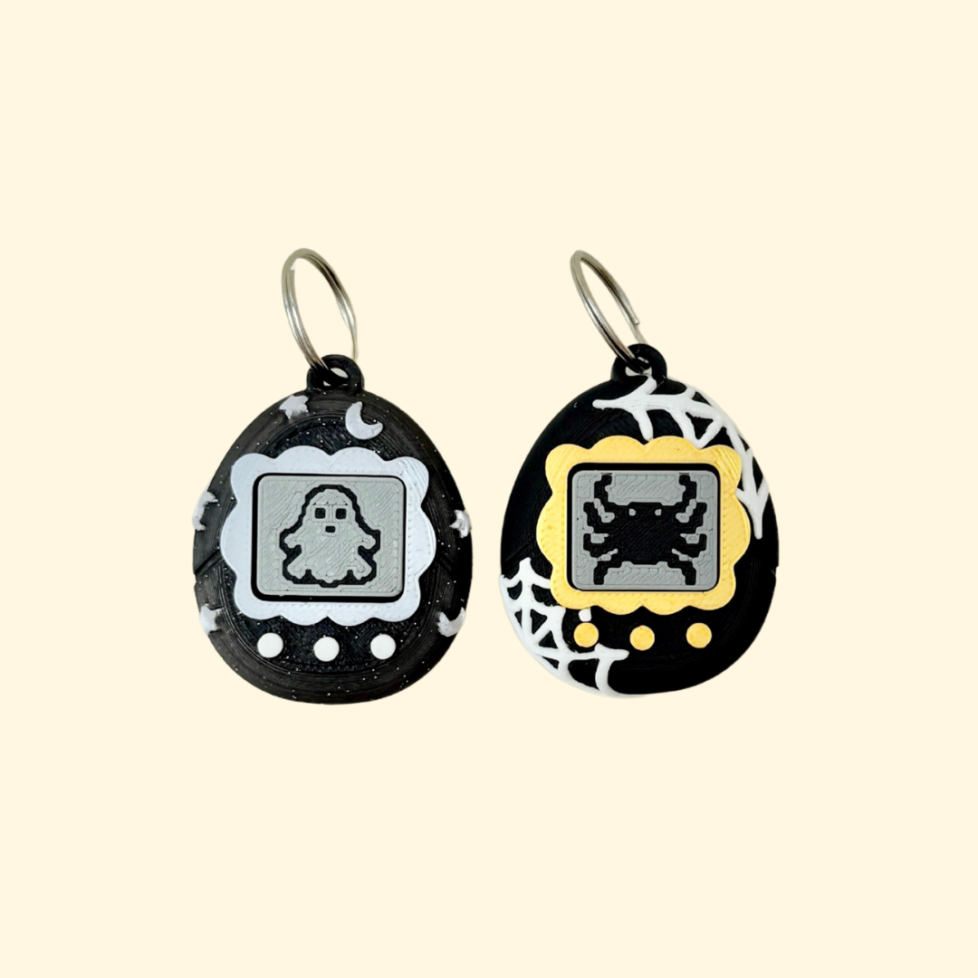 small keychain clicker for stimming and focus with retro game aesthetic
