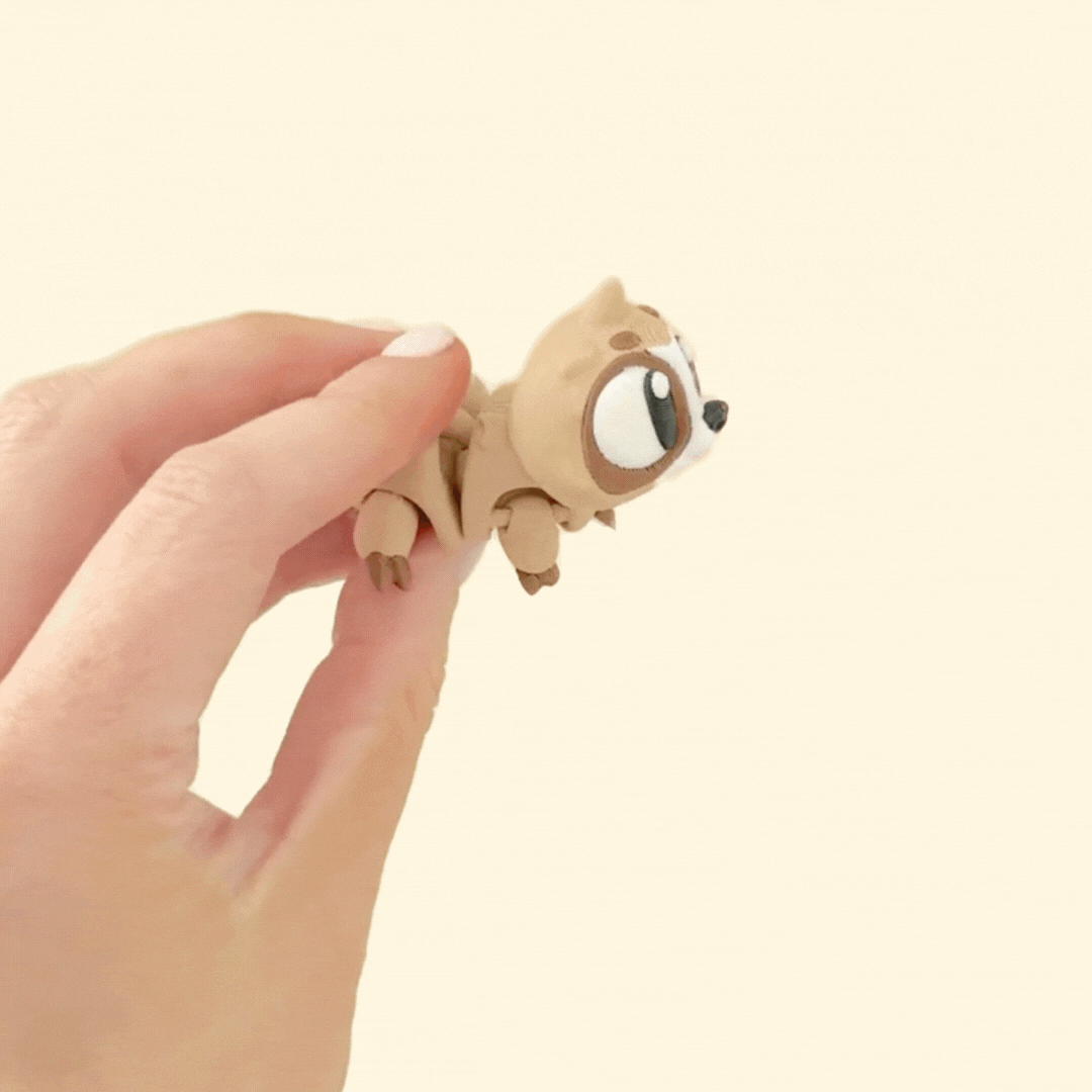 Adorable two-tone brown baby sloth fidget toy with articulated limbs and movable head for sensory play.