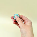 Colourful fidget toy designed for thumb movement, ideal for focus and anxiety relief.
