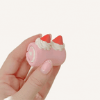 Novelty sweet-themed sensory clicker with two click points for one-handed fidgeting and focus.
