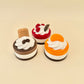Mini cake themed fidget clicker with a firm press feel and crisp click, designed for everyday stimming and calming

