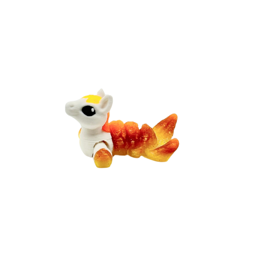 Collectable mini fidget with subtle wiggle motion for grounding
