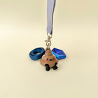 Small novelty poop keyring with moving legs and a sweet face, great for gifting and adding personality to bags.
